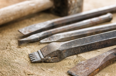 Several chisels with a malletの写真素材