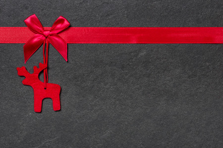 Slate board with a felt reindeerの写真素材