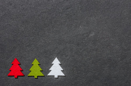 Slate board with three felt christmas treesの写真素材