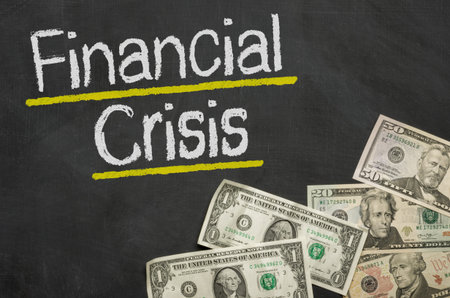 Text on blackboard with money - Financial Crisis