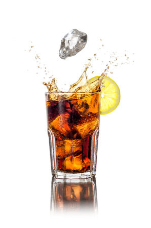 A longdrink with ice cubes and splashの写真素材