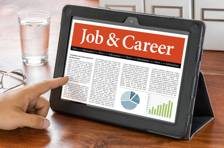 A tablet computer on a desk - Job and Careerの写真素材