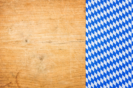 A wooden background with a bavarian tableclothの写真素材