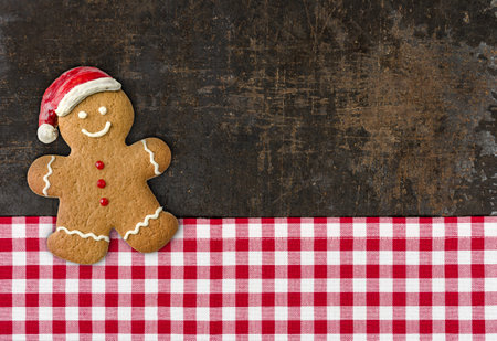 A gingerbread man on a baking tray