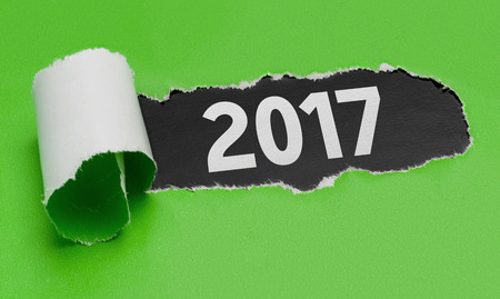 Torn green paper revealing the word 2017の写真素材