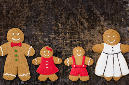 A gingerbread family on a baking trayの写真素材