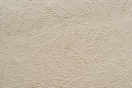 Beige paper with embossed leavesの写真素材