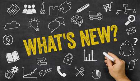 Whats new written on a blackboard with icons の写真素材