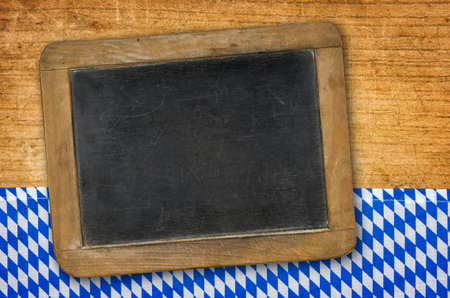 Rustic blackboard on a bavarian diamond patternの写真素材