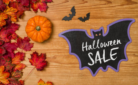 Autumn foliage with a pumpkin and a blackboard - Halloween Saleの写真素材