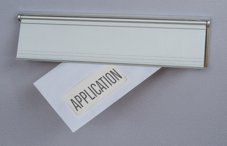 A letter in a mail slot - Applicationの写真素材
