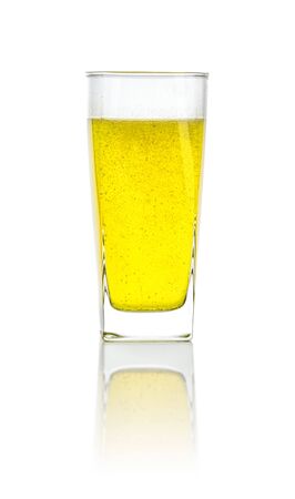 Glass filled with an orange soft drinkの写真素材