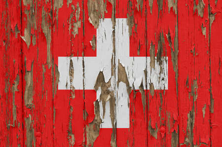 Flag of Switzerland on a weathered wooden wallの写真素材
