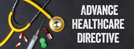 Stethoscope and pharmaceuticals on a blackboard - Advance healthcare directiveの写真素材