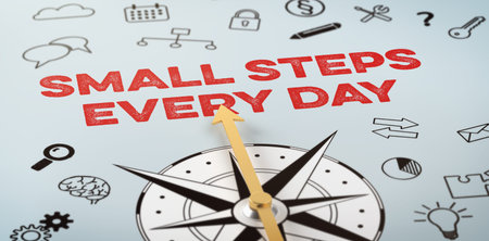 A compass with icons - Small steps every dayの写真素材