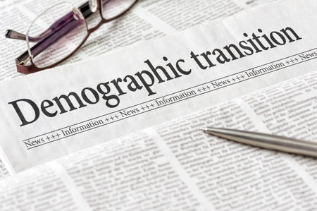 A newspaper with the headline Demographic transitionの写真素材