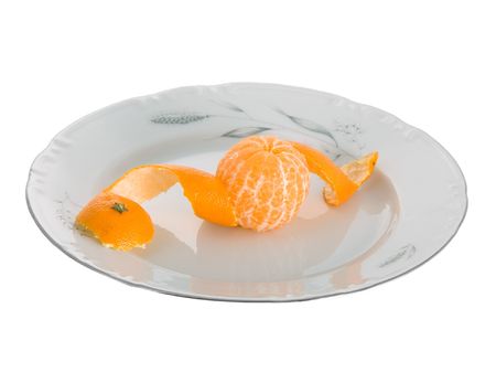 Peeled tangerines on plate isolated on whiteの写真素材