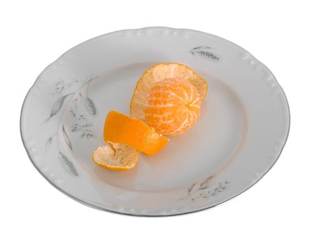 Peeled tangerines on plate isolated on whiteの写真素材