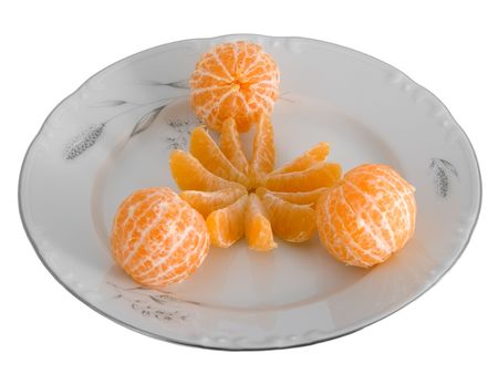 Peeled tangerines on plate isolated on whiteの写真素材