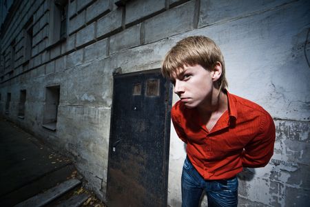 Wide angle portrait of a young man looking at cameraの写真素材