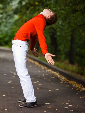 Portrait of a young man in a park - shallow DOFの写真素材