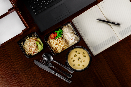 Business lunch on the desktop of your computerの写真素材