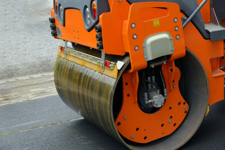 Asphalt road roller close-up. Asphalt compactor on the road