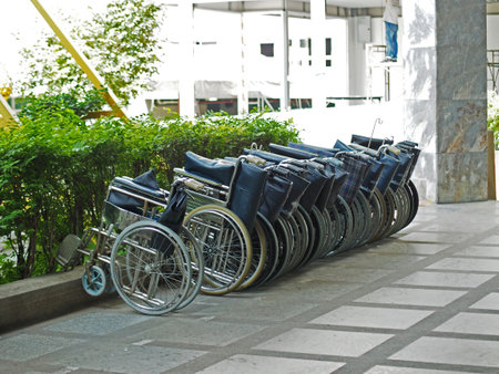 Wheelchairs in a row on the street at hospital.の写真素材