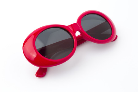 cute red round sunglasses on white backgroundの写真素材