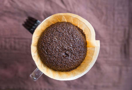 hand dirp coffee on the violet fabric.