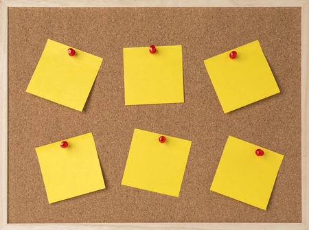 lot a yellow stickry note on wooden frame cork board.の写真素材