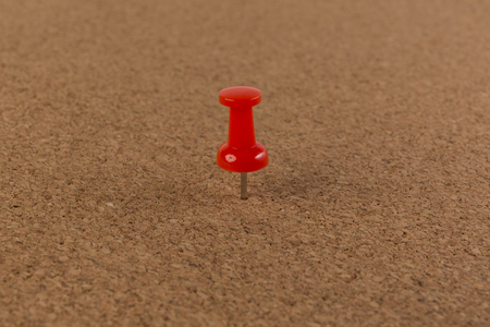 red pin on Cork board texture background.の写真素材