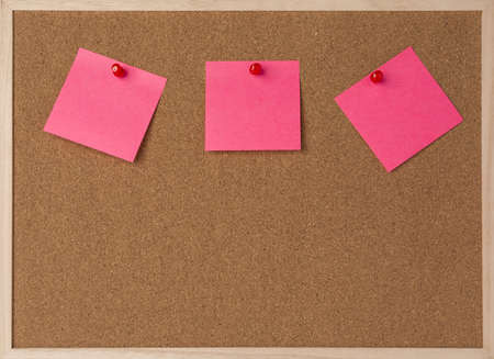 lot a pink stickry note on wooden frame cork board.の写真素材