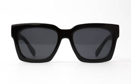 Chic sunglasses with black plastic frame isolated on white background, front view.の写真素材