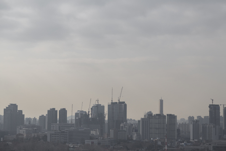 High angle horizontal building shot of sunset on a foggy day.の写真素材