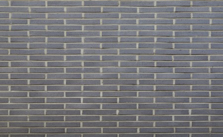 Warm grey brick wall texture background. Tiledの写真素材
