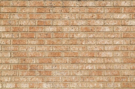 Old brick wall, old texture of red stone blocks closeup.の写真素材