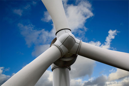 Giant Wind Turbine with blue sky background