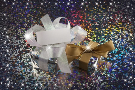 Christmas gift and stars with colorful backgraunの写真素材