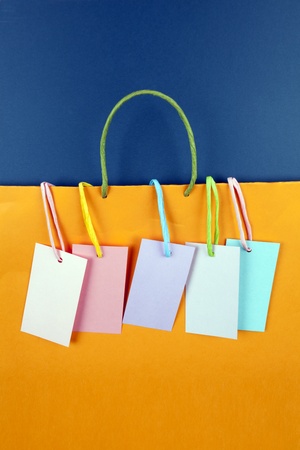 Paper bag with tags on blue backgroundの写真素材