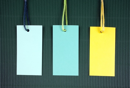 Price tag or address label with string on corrugated cardboardの写真素材
