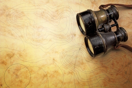 Close-up of a binoculare on the old map の写真素材