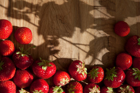Fresh ripe red strawberries on wooden textured table topの写真素材