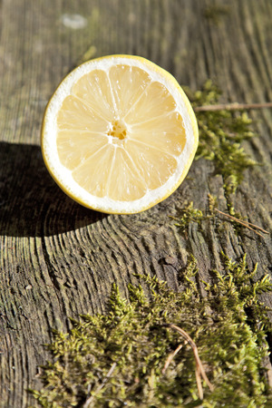 Lemon fruit on nature wooden backgroundの写真素材