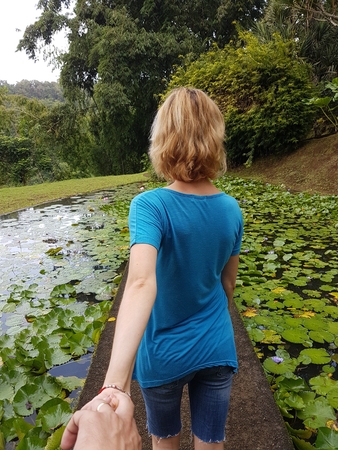 woman follow me in the jungle balata gardenの写真素材