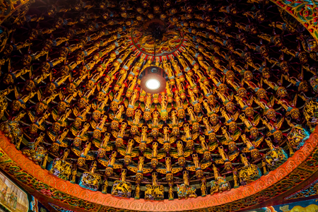 Nantou County, Taiwan - May 11, 2018: Hundreds of Buddha statues at the top ceiling of Wen wu temple, Taiwanのeditorial素材