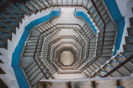 Nantou County, Taiwan - May 11, 2018: Spiral Staircase with rope netting inside the Ci En Pagoda at...