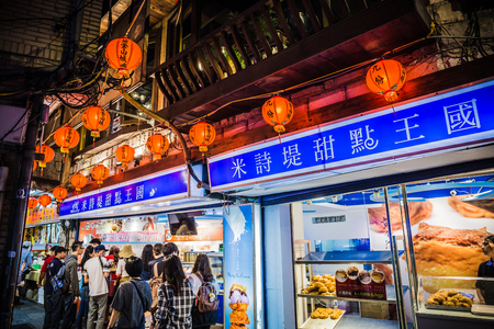 Jiufen, Taiwan - June 6, 2018: Busy street scene with many tourist walking in the narrow shopping street at Jiufen.のeditorial素材