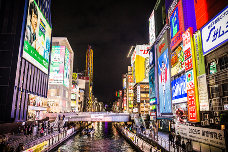 Osaka, Japan - November 19, 2018: A colorful cityscape scenery where hundreds of advertising and signboard neon lights lit up at one of Osaka's most popular tourist destinations at Dotonbori.のeditorial素材
