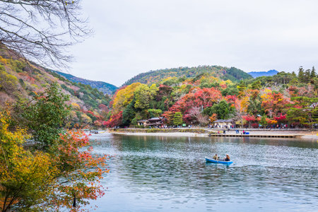 Kyoto, Japan - November 23, 2018: Arashiyama and Katsura river is the famous destination for tourist in autumn of japan. Many tourists come to see the beautiful autumn colors near the river.のeditorial素材